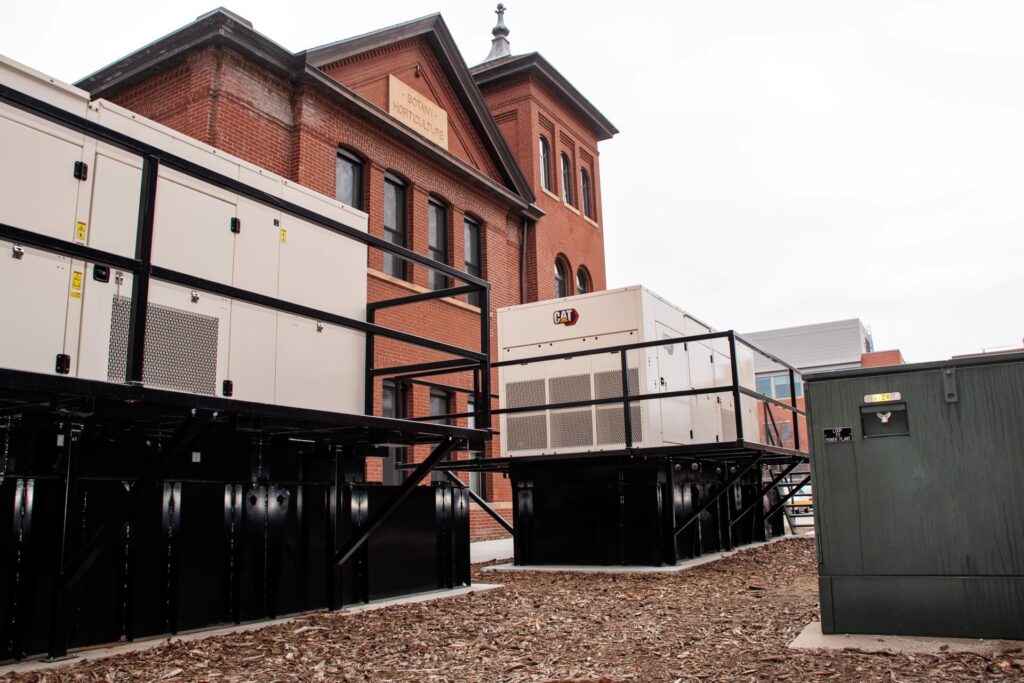 Generator and electrical equipment outside a brick building
