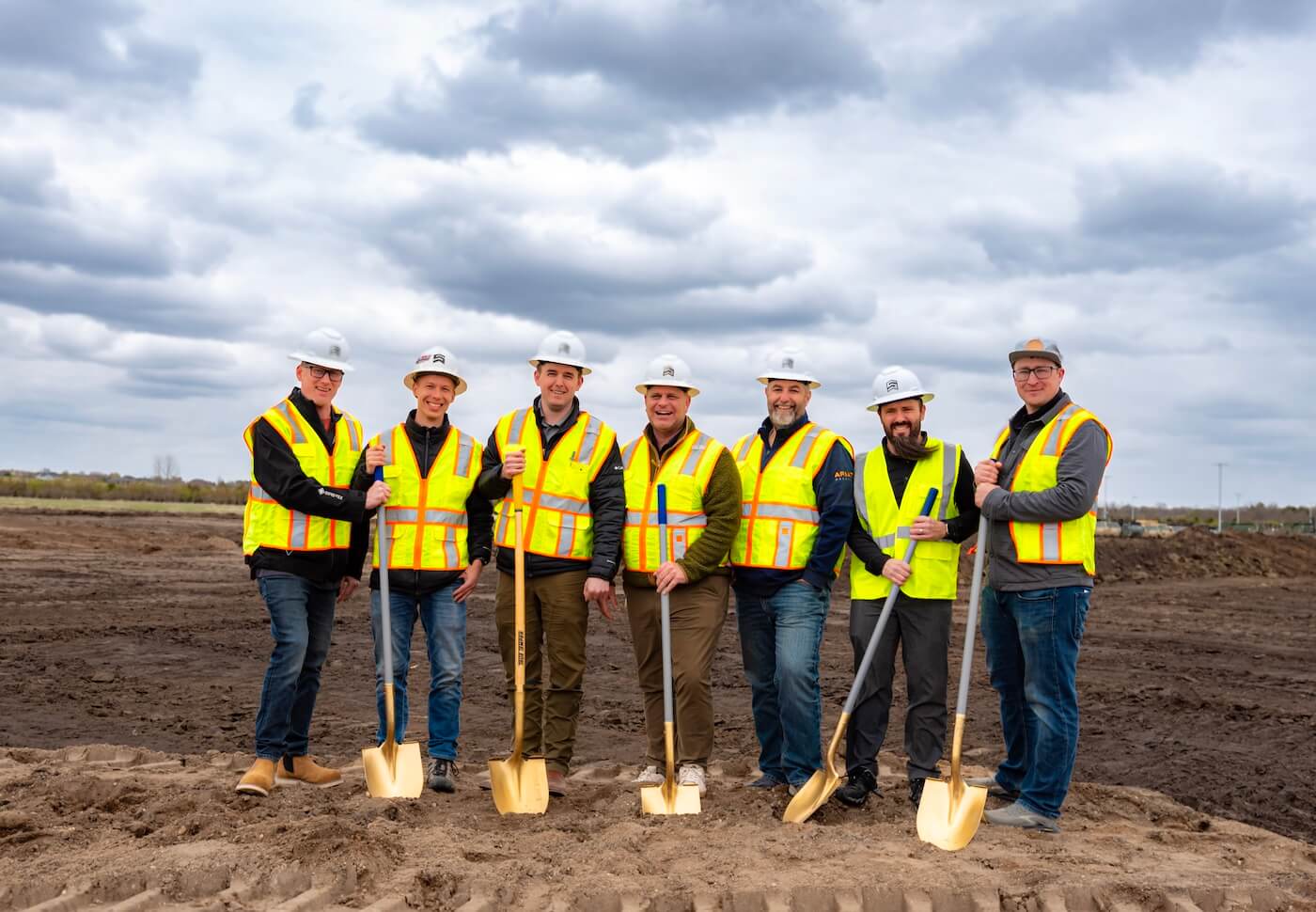 Sentry team members participating in a construction project groundbreaking